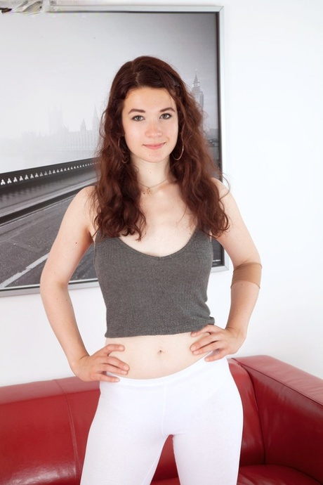 Pretty Teen Flora Slips Her Yoga Pant Down To Flash Her Hairy Muff