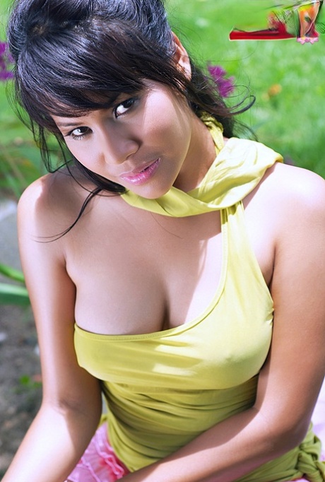 While nude, Nicha Chong from Thailand highlights her natural tits.