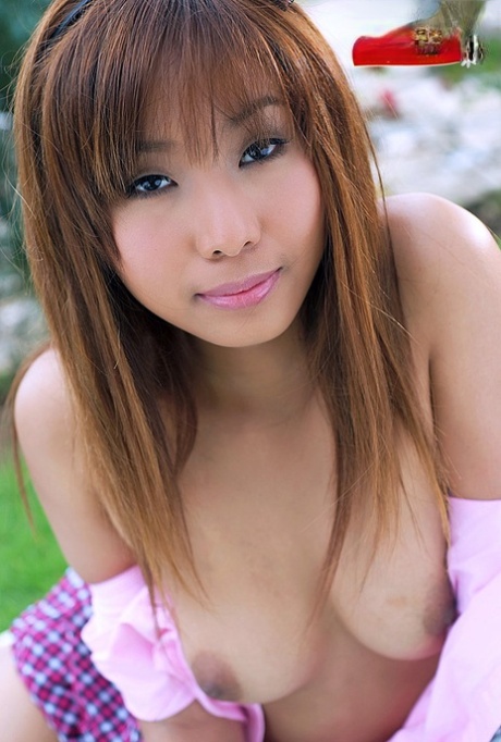 Redheaded Thai Girl Nana Sarin Gets Totally Naked On A Backyard Blanket