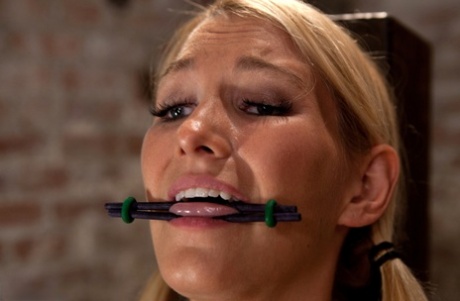 Bracing: A busty blonde is compelled to orgasm while helplessly restrained.