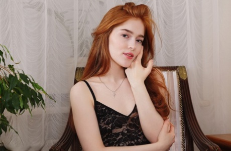 Fair skinned redhead Jia Lissa gets totally naked before eating a cupcake