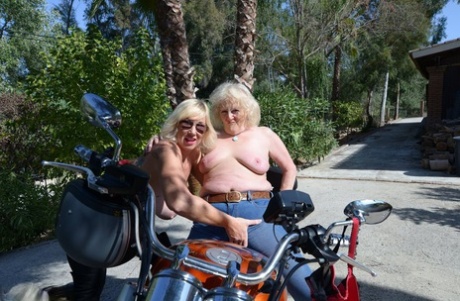 The lesbian partner of an older blonde and her lover enjoy riding a motorcycle together.
