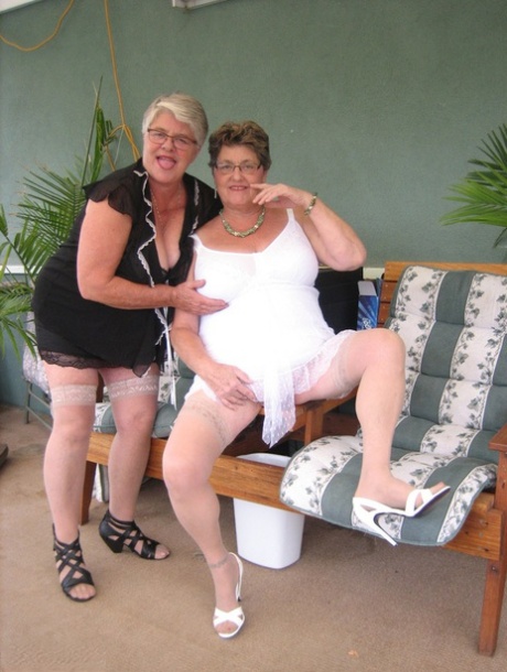 During their time as Girdle Goddess and Grandma Libby, the fat ladies in dresses hold their breasts after engaging in some form of dance called dildo.