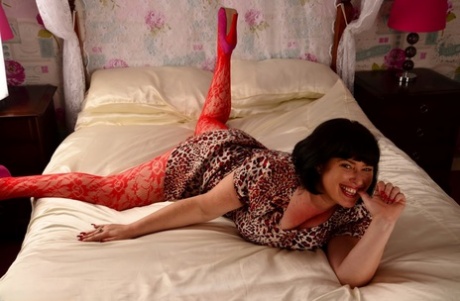 British amateur Juicey Janey models her big tits in a stocking that lacks the use of crotting.