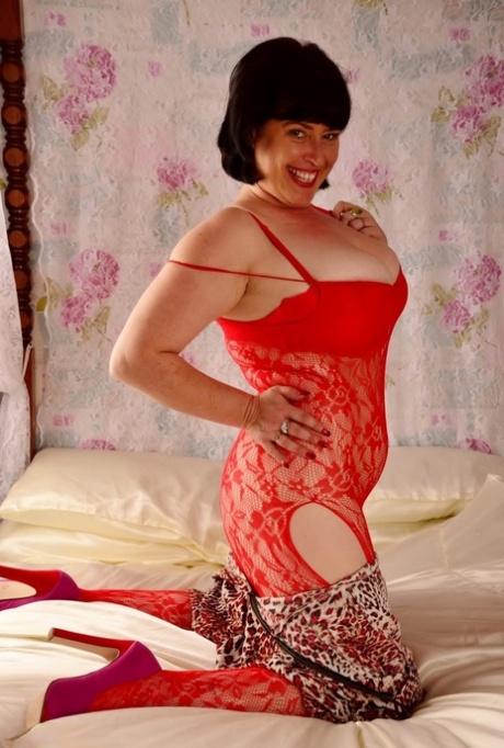 Old British amateur Juicey Janey exhibits her large tits while wearing a stocking that is not equipped with the hind legs, known as "crotch".