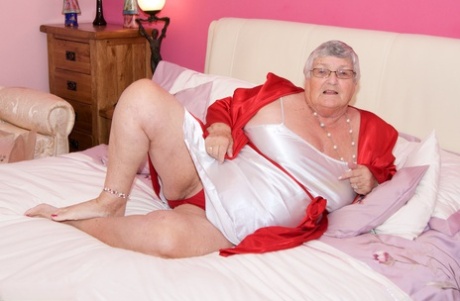 Obese Nan Grandma Libby Toys Her Pussy On The Bed With Her Glasses On