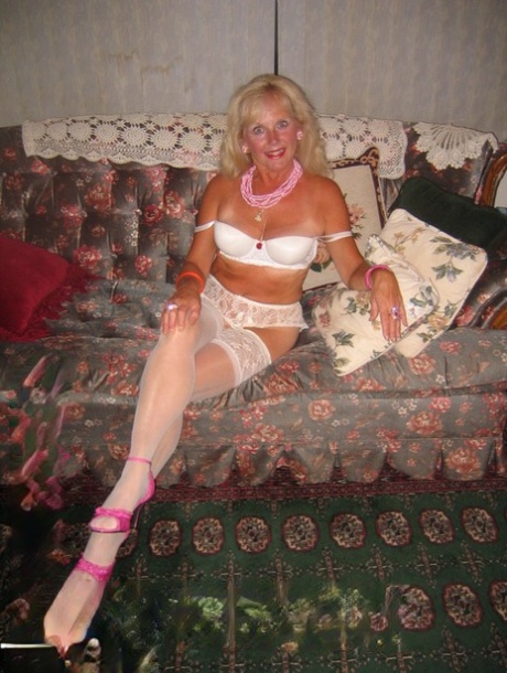 Prior to POV sex, Ruth of blonde age donnes satin panties and white stockings.