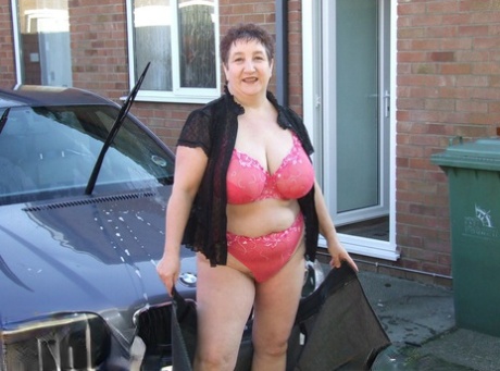 Fat Old Lady Kinky Carol Bares Her Big Tits While Soaping Up During A Car Wash