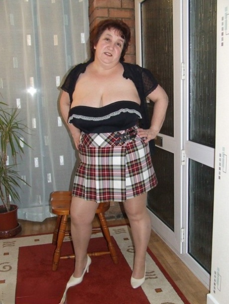 The UK's Kinky Carol, an upskirt competitor, displays her buttocks and thong.