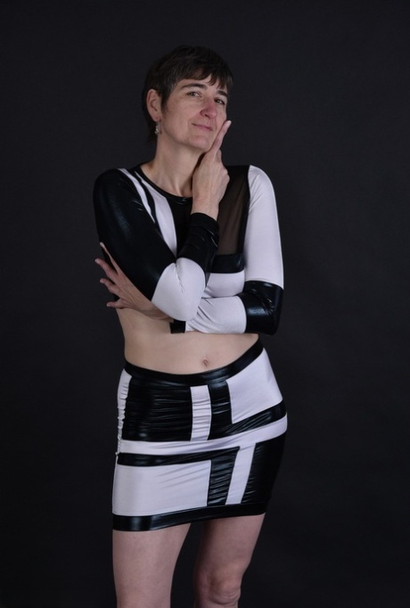 The granny with dark hairs reveals her tits and pussy, which are sagging, for the first time.