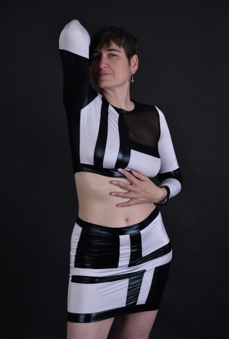 Her sagging tits and pussy are revealed to us for the first time when she walks behind her dark haired granny.