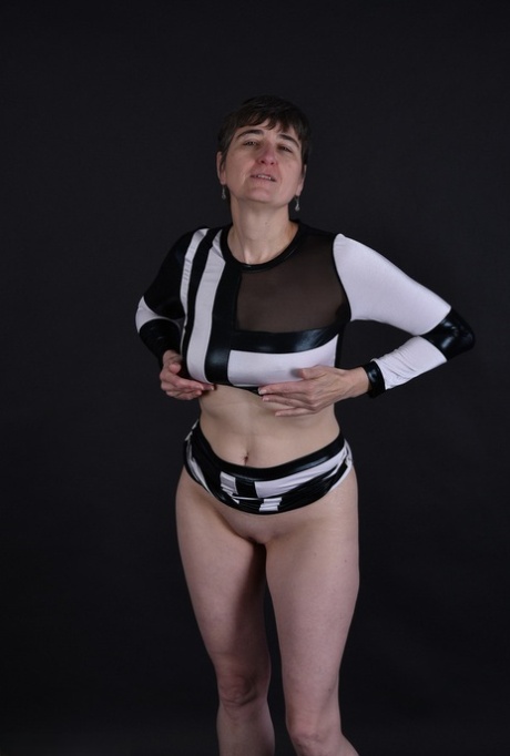 With her dark hair on her face, granny's tits and pussy are revealed for the first time.