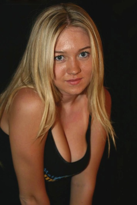 After modeling in the nude, Alison, a blonde girl, embraces her girlfriend.