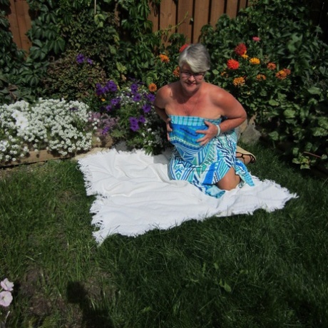 Fat Nan Girdle Goddess Strips To Sheer Pantyhose On A Blanket By A Flower Bed
