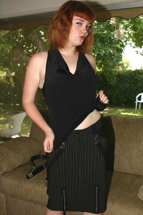 After trying out for the first time, Sawyer, a natural redhead, pins her big breasts.