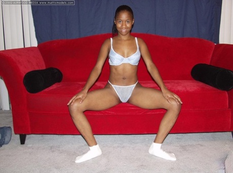 Black Amateur Monique Spreads Her Pussy Lips After Getting Naked On A Red Sofa