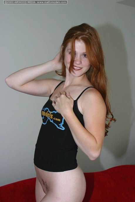Fair Skinned Redhead Tiffany Exposes Her Perky Breasts In Solo Action