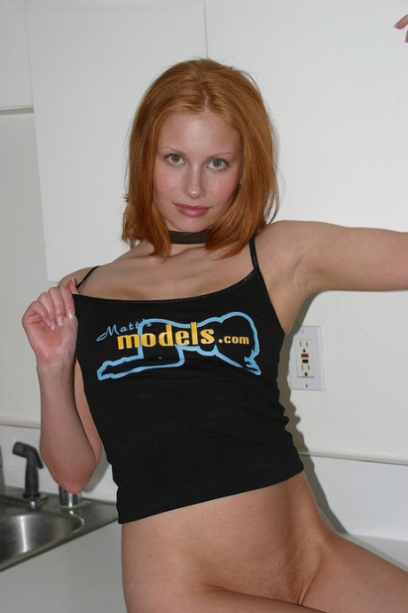 Anya, being a natural redhead, exposes her natural tits by wearing a tank top.