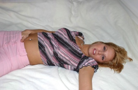 Blonde Amateur With A Pretty Face Unveils Her Firm Breasts As She Gets Naked