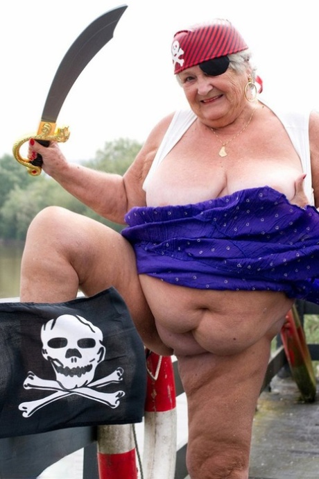 A pirate-clad British granny bares her fat body on a bridge.