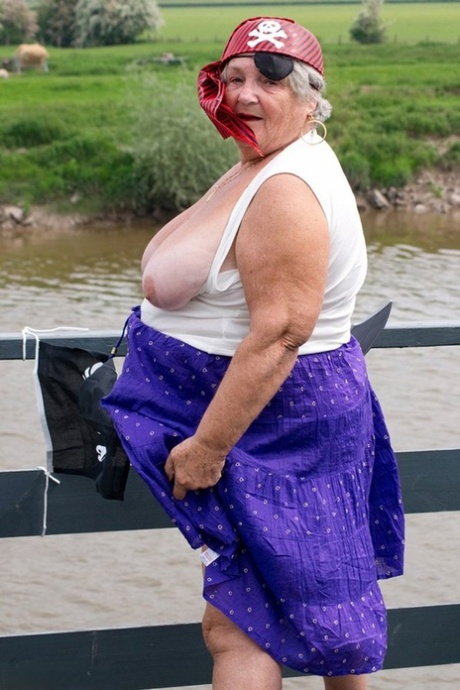 While on a bridge, Fat British granny exposes herself in pirate costume.