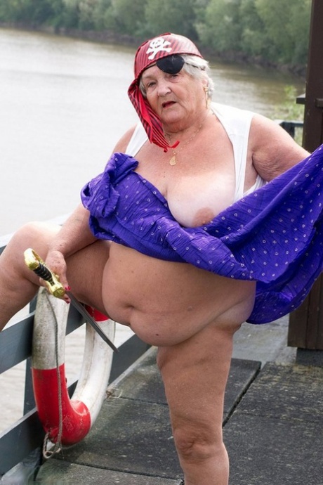 STOCKED: This fat British granny flaunts her pirate suit on to a bridge in the spirit of freedom.