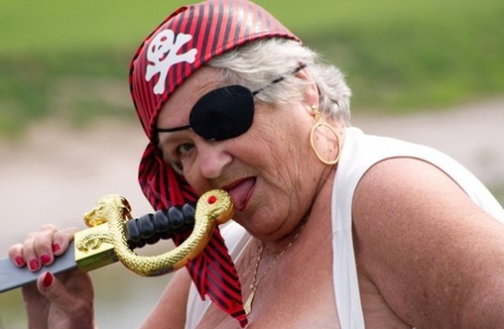 A bridge is the location where a fat British granny can be seen, naked and dressed in pirate costume.