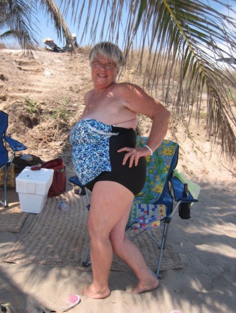 A nude picture of the fat granny girdle Goddess is taken at an event during her time in public.