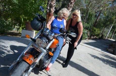 Old blonde Melody finds a woman's breasts and fondles on her motorcycle.