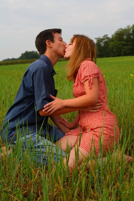 Her boyfriend and natural redheads have sex in the middle of a wide open field.