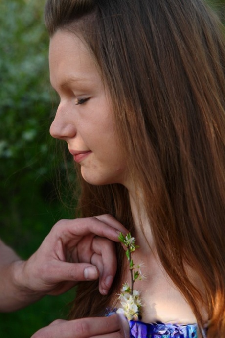 Sweet teen and her boyfriend have sex on the ground near a tree line