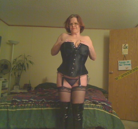 Misha MILF (redhead amateur) looses her large pants from a corset in OTK boots.