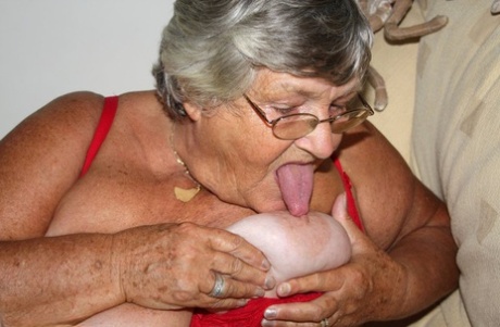 Mamma Libby, the morbidly obese grandma, uses a mouthful to lick her nipple before giving her cuddle.