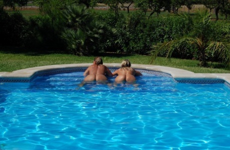Sweet Susi, a young adult who is overweight, and his girlfriend embrace after exhibiting prominent buttocks in a swimming pool.