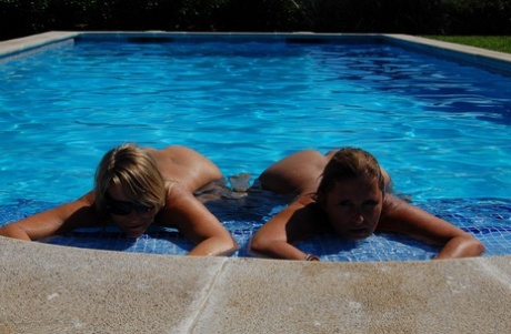 Grateful eyed: Mature fatty Sweet Susi (left) is hugged by his girlfriend following her display of big buttocks in pool.