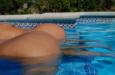 The girlfriend of mature fatty sweet Susi embraces her after she exhibited large buttocks in the pool.