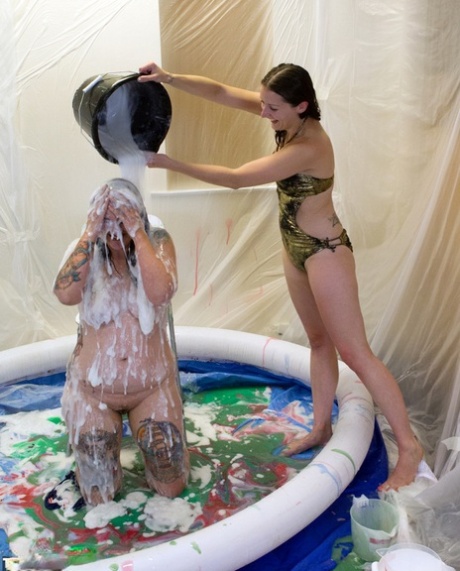 Gunk is used to cover the body of an amateur lesbian in a wading pool.