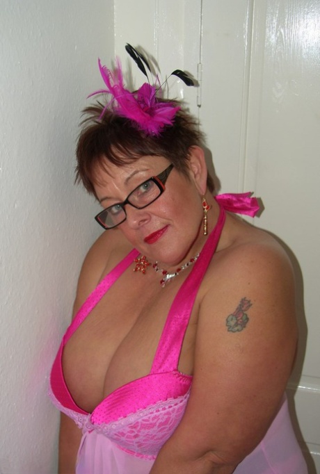 Amateur BBW Warmsweethoney looses her large tits from lingerie with glasses on