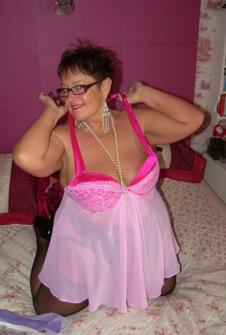 Amateur BBW Warmsweethoney looses her large tits from lingerie with glasses on