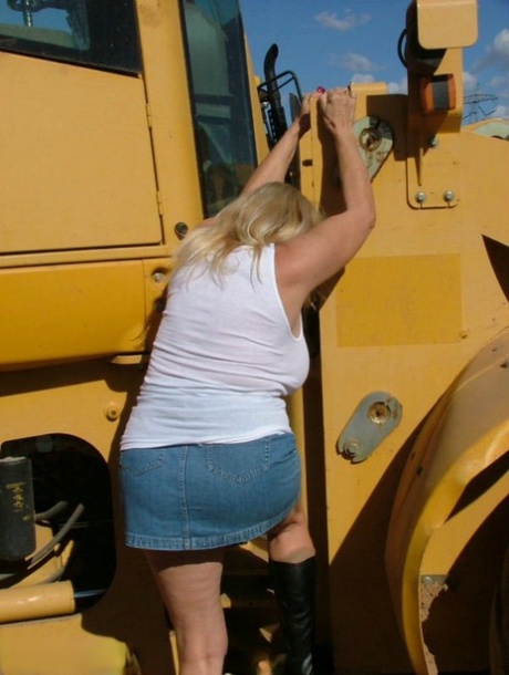 A heavy equipment makes Adonna's appearance, as she exposes herself as a plump, mature blonde with excess weight.