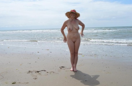 Older Amateur Barby Slut Wades Into The Ocean In Nothing More Than A Sun Hat
