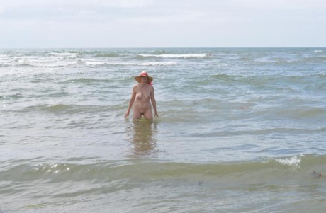 Barby Slut, an older ex-parasite, ventures into the ocean in a sun bonnet.