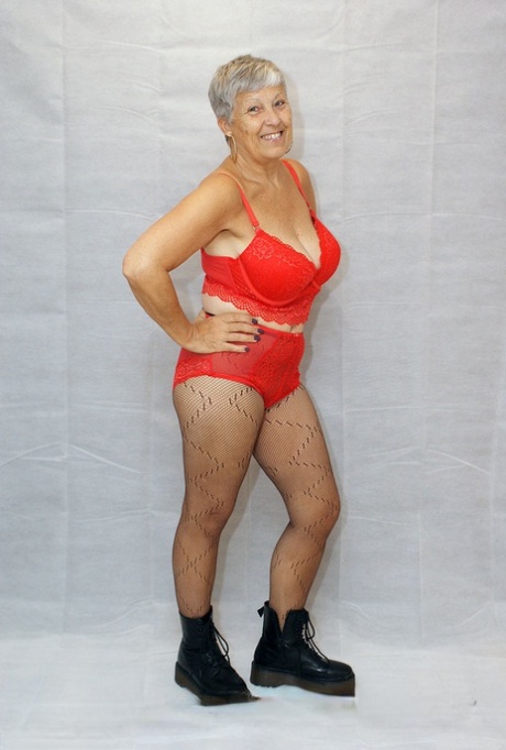Vintage Savana models her outfit in red pantyhose and black boots as part of her amateur wardrobe.