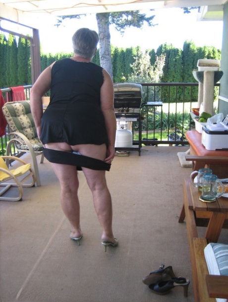 Old Lady Girdle Goddess Shakes Her Big Butt While On A Veranda