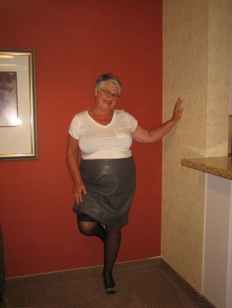 Old woman's girdle goddess frees her fat body from clothing by wearing stockings.