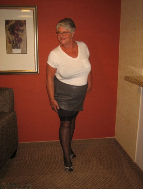 Dressed in stockings, the Girdle Goddess of old woman liberates her fat body from clothing.