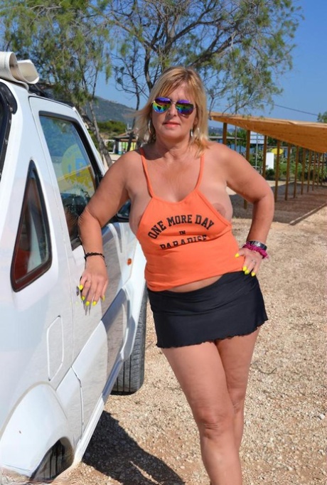 Chrissy exhibits her slutty body shape while wearing large tits during her beach nude walks.