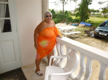 Fat mom: Grandma Libby shows off her tan body on the balcony.