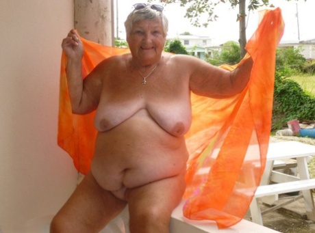 Balcony-bubbler: Fat mom Grandma Libby flaunts her dark skinned body on the sun-kissed balcony.