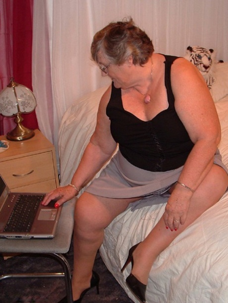 The vagina is creamed by Obese Granny Grandma Libby after she gets naked on her bed.
